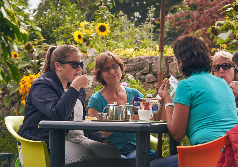 Students enjoying a cream tea in Jersey